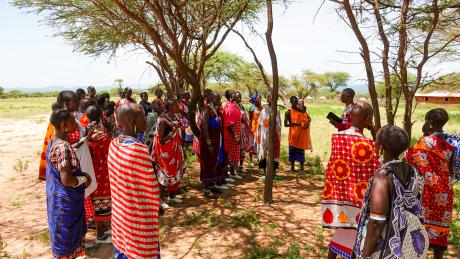 Evangelist Elisha sharing the word of God with Maasai women