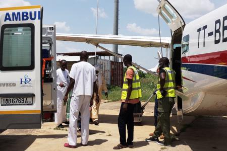 moving patient into the ambulance