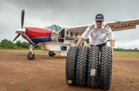 Unloading tires from a Cessna Grand Caravan