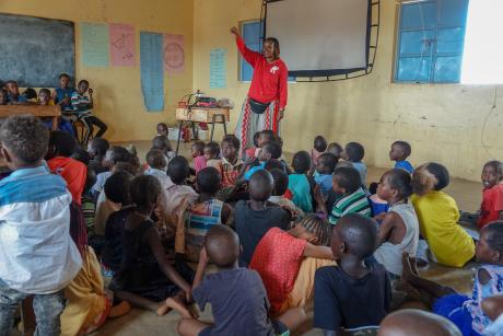 A representative from CBN conducts a children's ministry.