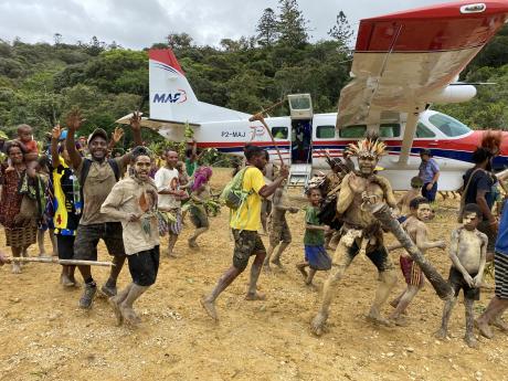people of Yakona dancing around the aircraft